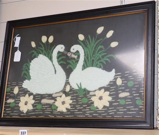 A beadwork and fabric panel of two swans 43 x 57cm excluding frame